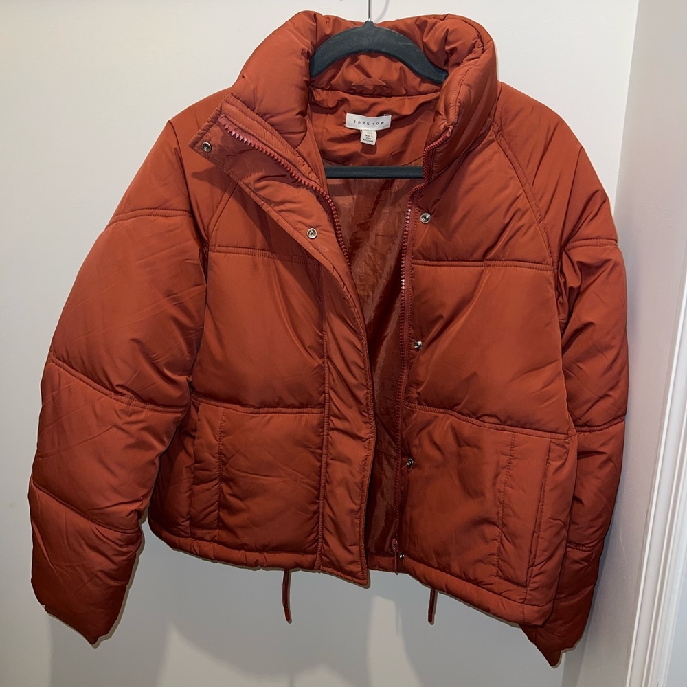 Topshop puffer jacket in rust; size 4